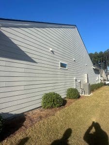 Freshly painted Charleston SC home exterior with gray lap siding and white trim