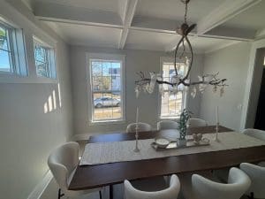 Freshly painted Charleston SC dining room with soft gray walls and white coffered ceiling