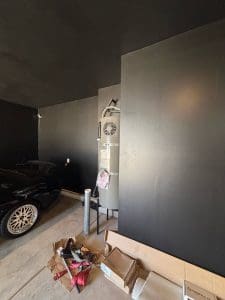 Charleston SC garage interior with freshly painted dark charcoal walls and ceiling during a painting project