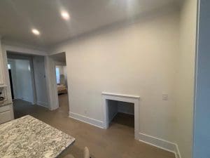 Freshly painted Charleston SC interior with soft white walls, recessed nook, and hardwood floors
