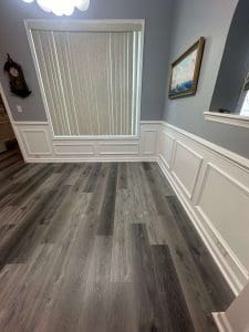 Freshly painted Charleston SC dining room with blue-gray walls and white wainscoting trim
